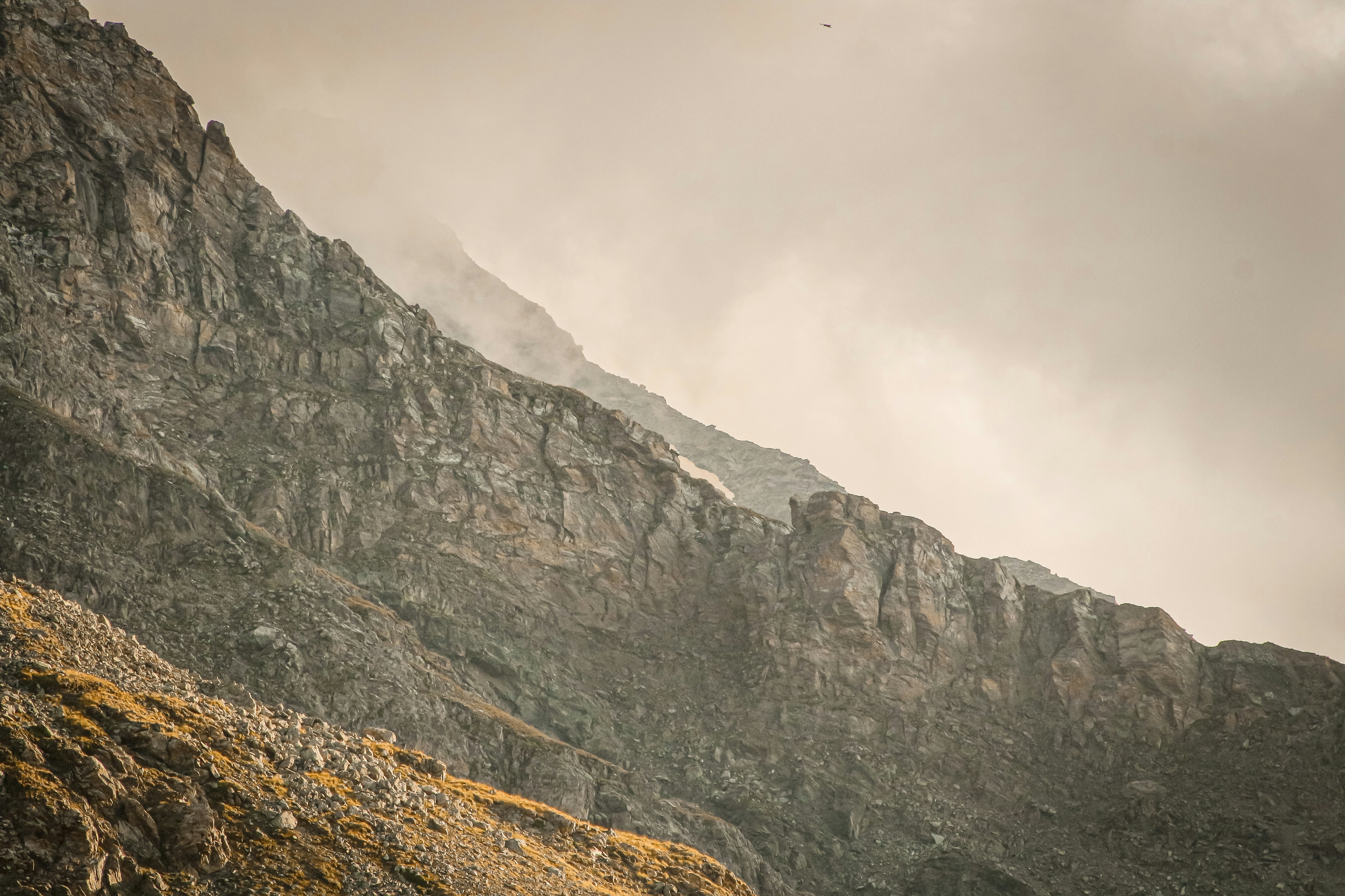 gray rocky mountain under white sky during daytime